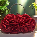 Satin flower clutch bag